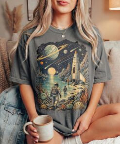 Retro Sci-Fi Space Astronaut T-Shirt Vintage Cosmic Exploration Graphic Tee with Rocket & Planet Art